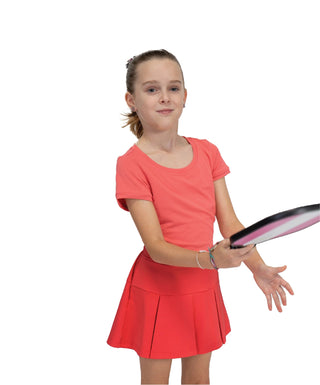 Every Day Tee Rose Pink — Girls' Golf Tee, front view, on model, holding a racket