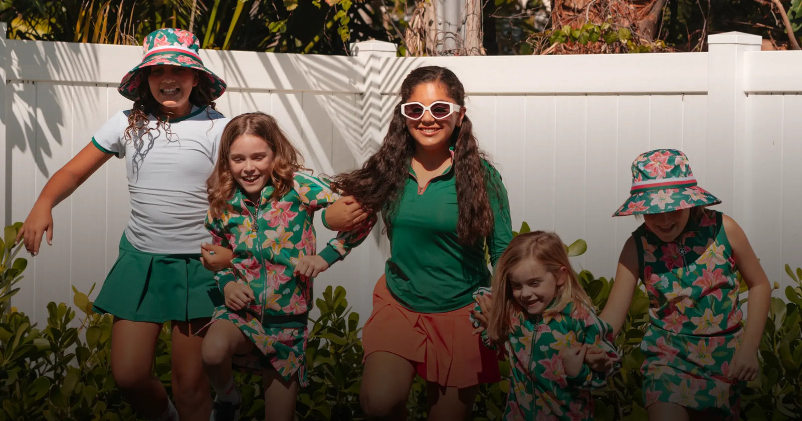 Five girls with golf clothes by Marie Birdie playing outside