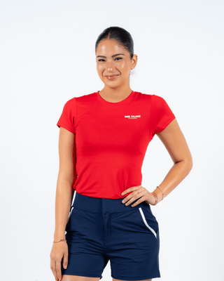 Golfing Era Tee Red — Women's Golf Tee, front view, full length on model