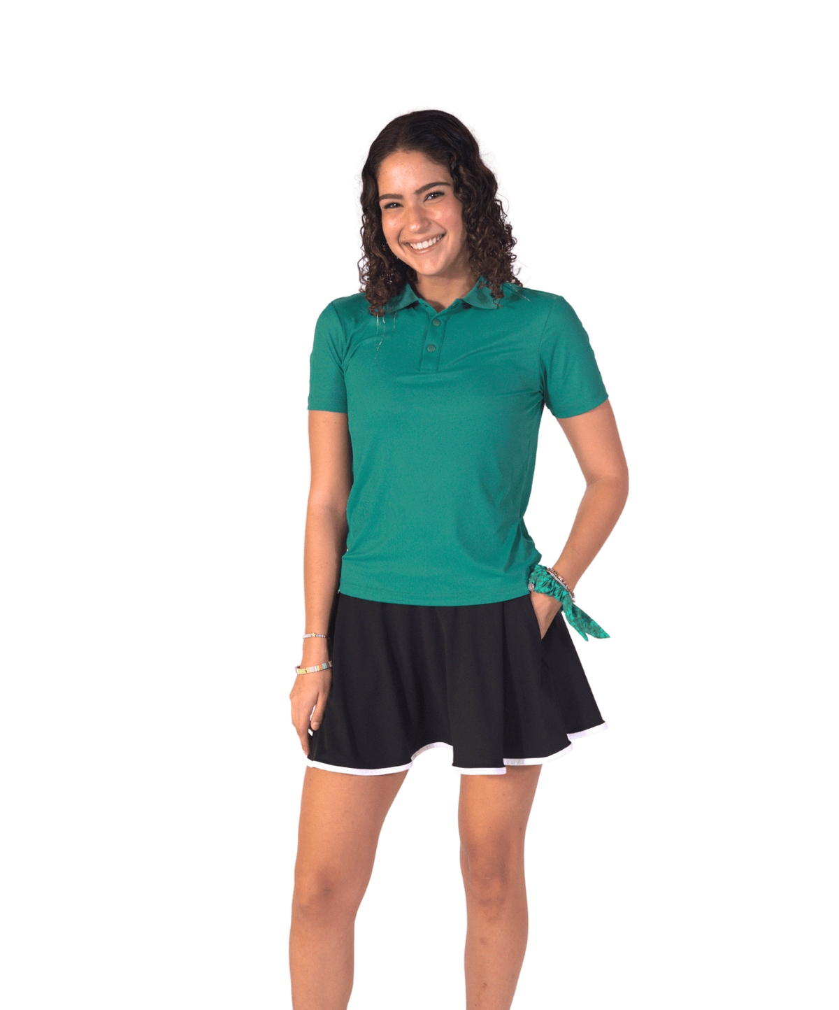 Woman wearing the RB Polo in Lucky Green with a black skort, full length